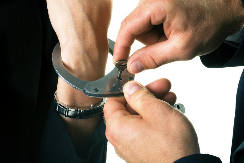 hand in a wristband and another person opening it