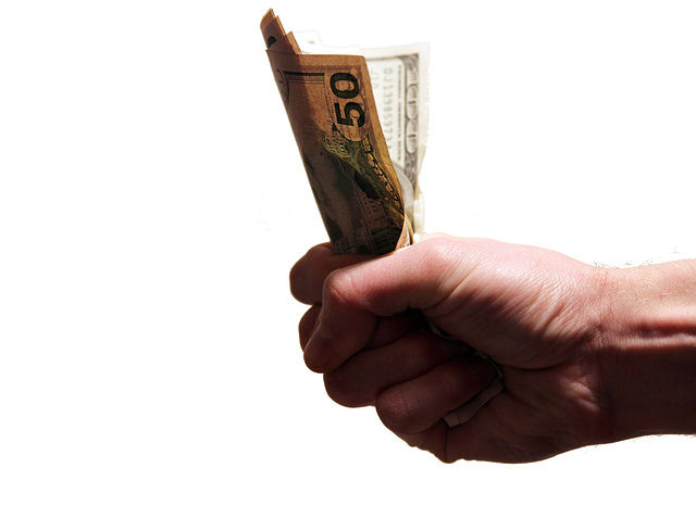 hand holding bail bond cash