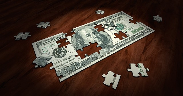 100 dollar banknote in puzzle view.