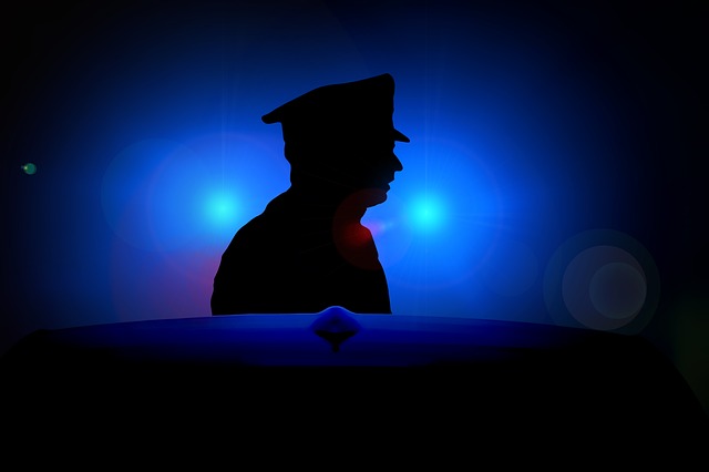 Man's silhouette on blue light police background