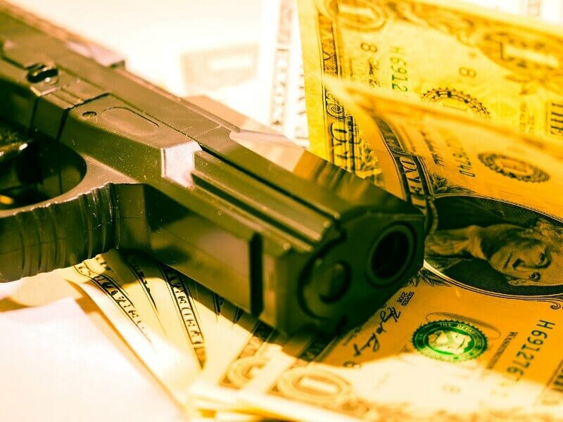 Monye and gun close up